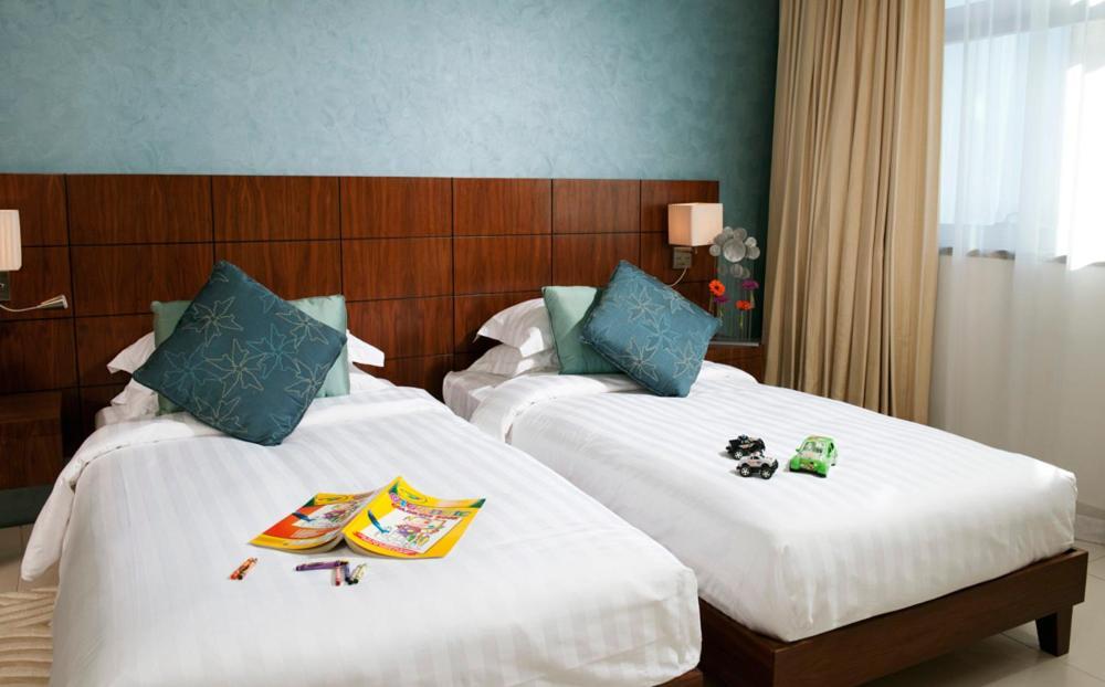 프레이저 스위트 도하 아파트 호텔 외부 사진 A typical bedroom at the hotel